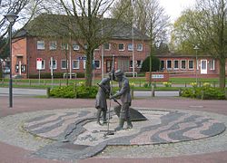 The town hall with a sculpture Jan und Gret symbolising the hard work of coastal fishermen before the onset of tourism[1]