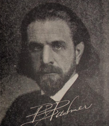 Headshot of Palmer, with his signature written below his face