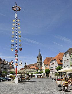 Market square with the Church of the Assumption of the Virgin Mary in the background