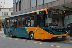 An Alexander Dennis Enviro200 in green and orange livery used from 2007 until 2021