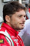 Giancarlo Fisichella wearing a red and white racing suit in 2012