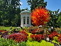 Henry Shaw's mausoleum at the Missouri Botanical Garden with a glass art piece by Dale Chihuly in the front of it as of 2023.