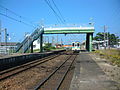 View of platform with approaching 100 series train