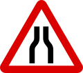 Road narrows on both sides