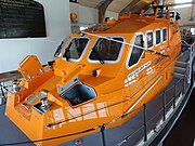 The current Tamar-class all-weather lifeboat Alfred Albert Williams (ON-1297). Designed to be launched from a slipway, with her mast and aerials being lowered to fit into the Bembridge boathouse which was built specifically to house this class of lifeboat.
