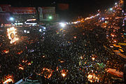 Aerial photo of large, nighttime demonstration