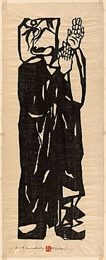 Monk in black robes looking at the sky with hands held up