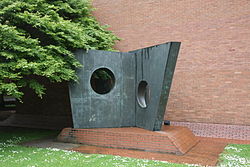 Bronze sculpture outside brick building
