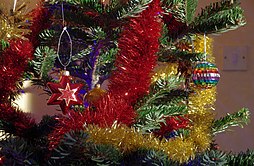 Christmas tree with tinsel garland.