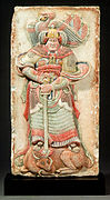 Song wall panel from the tomb of Wang Chuzhi depicting a deity wearing lamellar armoured skirt and winged helmet.