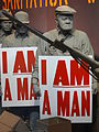 A diorama of the Memphis sanitation strike showing posters reading "I AM A MAN"