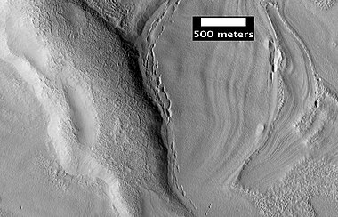 Pits in Protonilus Mensae, as seen by HiRISE, under the HiWish program.