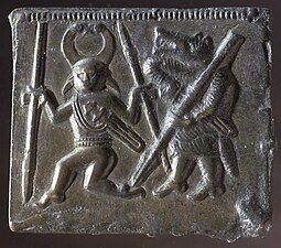 An animal headed warrior and a one eyed character on one of the Torslunda plates.