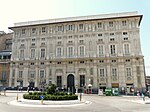 A large palace with a beige facade