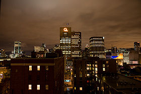 Montreal skyline at night with the Hydro-Québec Building in the center.