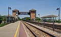 The platforms, tracks and pedestrian bridge at Sturtevant station in June 2014