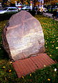 A rock with a commemorative plaque dedicated to the emblem of Rodło.