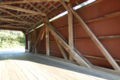 Inside of the bridge showing the Multiple kingpost truss and the Burr-type pyramidal-shaped support truss design