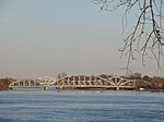 Two non-identical steel frame bridges side by side.