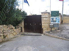 The modern gate that closes off the causeway.