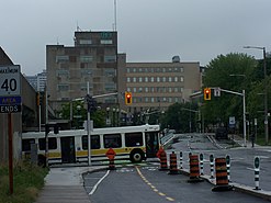 HSR bus exiting an underpass, and is placed in front of the Hamilton GO centre