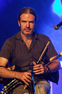 Cillian playing the Uilleann Pipes during a Lúnasa concert