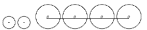 Diagram of two small leading wheels, and four large driving wheels joined by a coupling rod