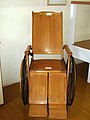 Wooden wheelchair dating to the early part of the 20th century