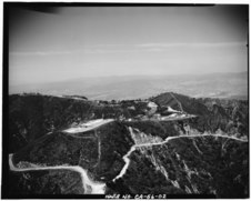 Aerial view of former Nike missile site near Los Angeles, showing radar site in upper left and launch site in foreground. By Everett Weinreb for HAER (April 1988).