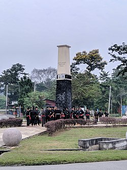 A monument regarding heritage town status on a roundabout