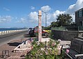 A view of the Christena Memorial on the Charlestown waterfront on Nevis, looking north towards St. Kitts, with the Alexander Hamilton house on the right