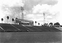 Bleachers and lights, seen across a football field