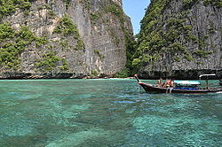 Beach surrounded by limestone cliffs, typical of the islands