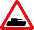 Slow-moving military vehicles likely to be in or crossing the road