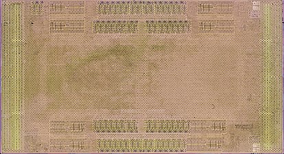 Removed and flipped over center die before metallization etching; visible are pads for flip chip solder balls