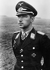 Black-and-white photograph showing the face and upper body of a young man in uniform.