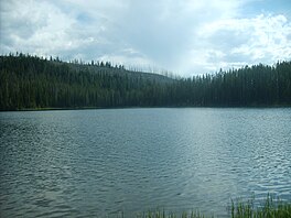 White clouds over a choppy Crawfish Lake on a summer day.