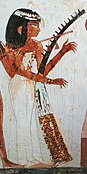 woman playing vertical harp in Egypt
