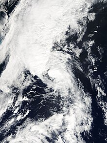 Satellite imagery of a disorganized tropical storm undergoing an extratropical transition.