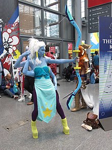 Cosplay of a blue character with four arms and a bow