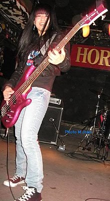 Taneda performing with Shonen Knife in October 2011 during the Osaka Ramones tour