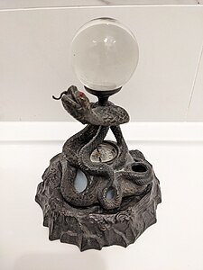 Bronze sculpture of cobra with inkwell and compass. Published 1850.