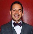 Shaun Majumder interpreta Andrew Palmer