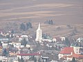 A closer view of the village from the castle, with the Church of Saint Margaret of Antioch seen prominently (March 2012)