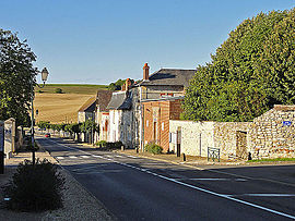 The main road through the village, and the town hall in the centre