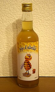 étiquette de bouteille avec comme illustration une abeille mâle satisfaisant un besoin naturel