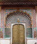 Multifoil arch with mural on lotus gate, City Palace, Jaipur, India. An example of Rajput architecture, built between 1727-32.[43]