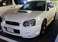 Subaru Impreza S203, a high-performance variant of the standard Subaru Impreza sedan. This photo shows the front of the car, which is white; there is a "S203" badge on the front grille.