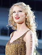 Taylor Swift in a golden dress