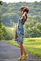 Young woman wearing sundress and Christian Louboutin shoes, 2009.